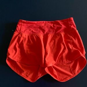 Bright red/orange lululemon speed up shorts